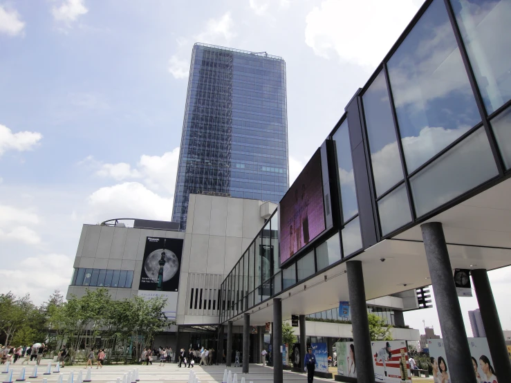 a tall building next to some buildings with windows