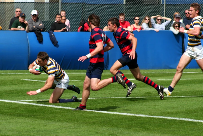 rugby players are in action on the field