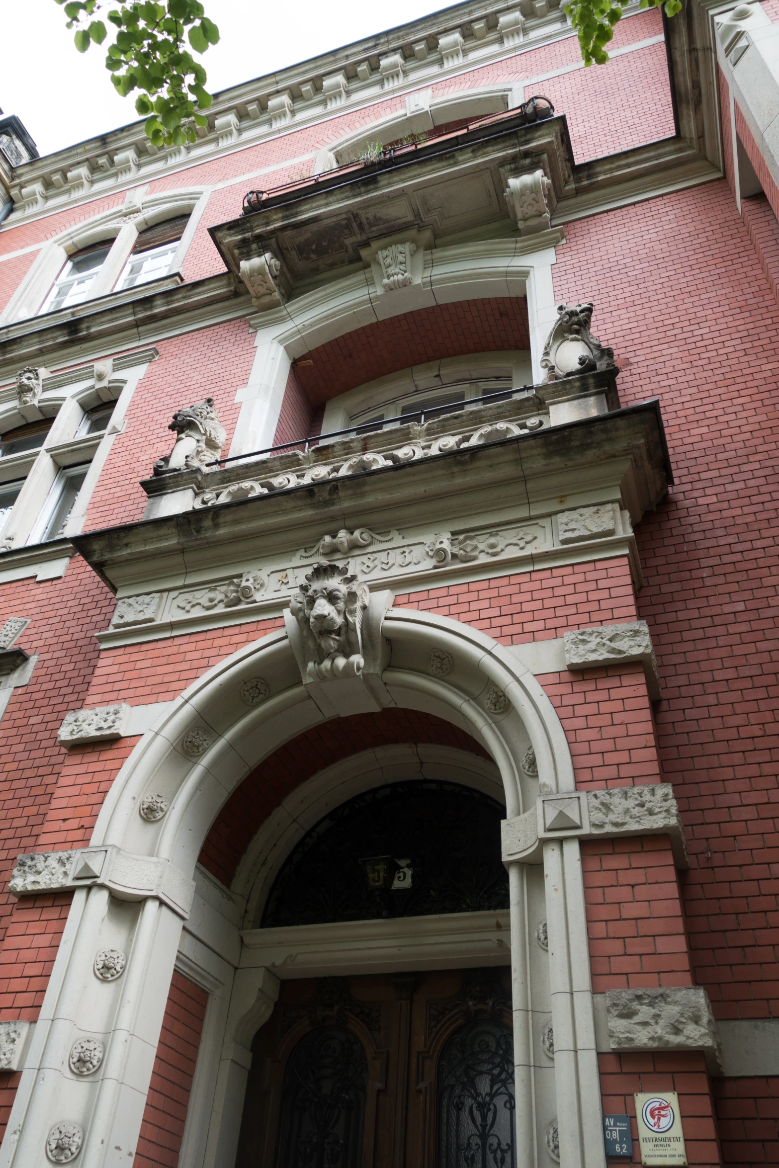 a stone arch above a doorway on an old building