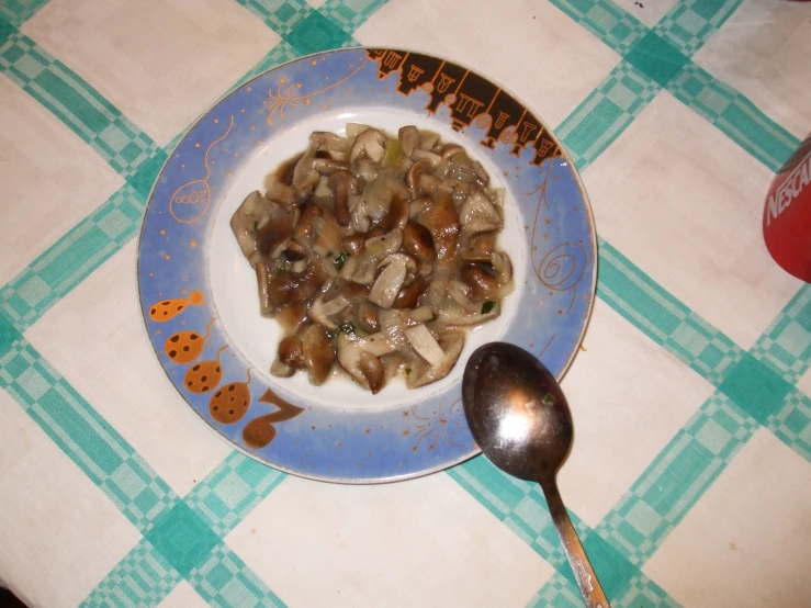 a plate with pasta and broccoli and some ginger cookies