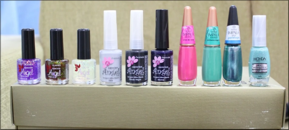 a group of bottles with various nail polish items