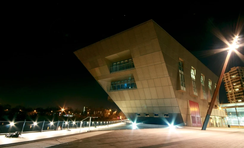 the outside of a building lit up at night