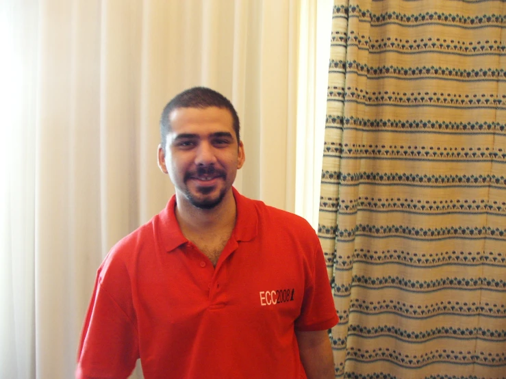 a man is posing for the camera by a shower curtain