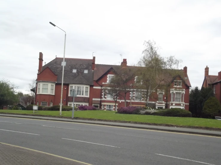 a two story home with a long front yard