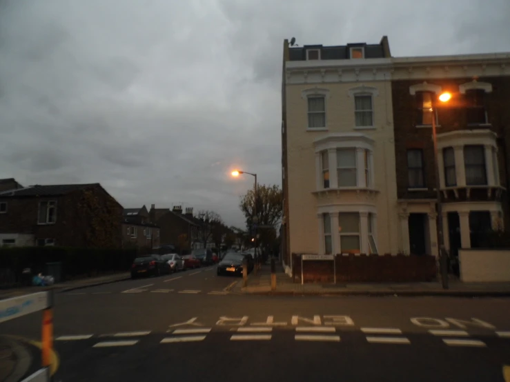 a street view with cars parked on the street