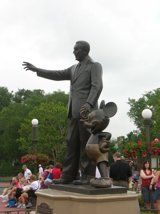 a statue is shown with an animal by him