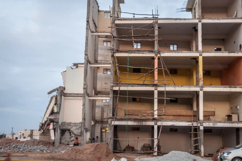 the top part of a building being built with scaffolding and concrete