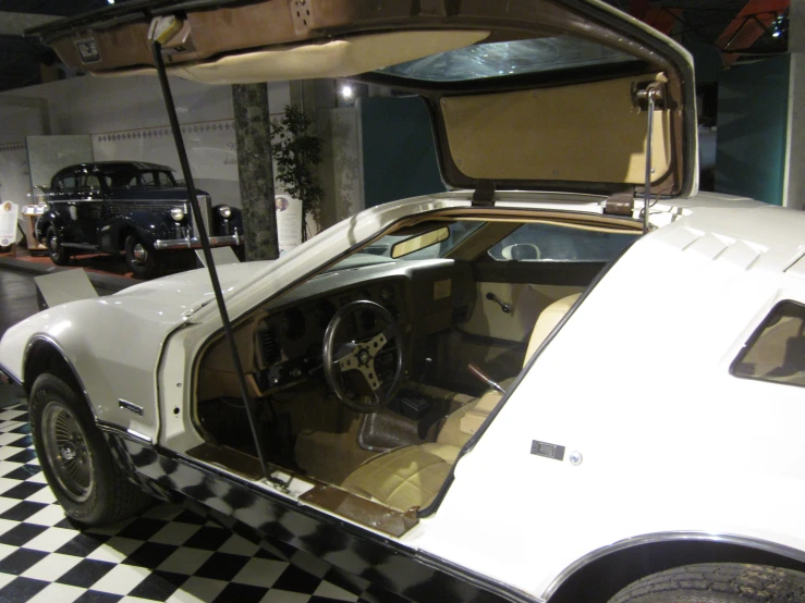 an antique car on display in a museum