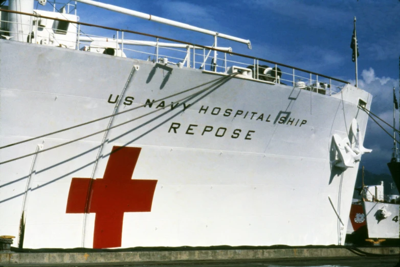 a us navy hospital ship with the cross painted on it