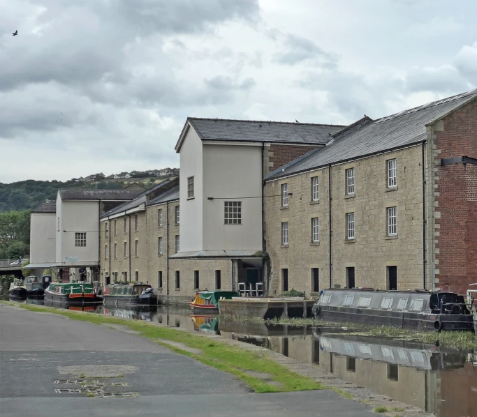 buildings reflecting in the water near a waterway