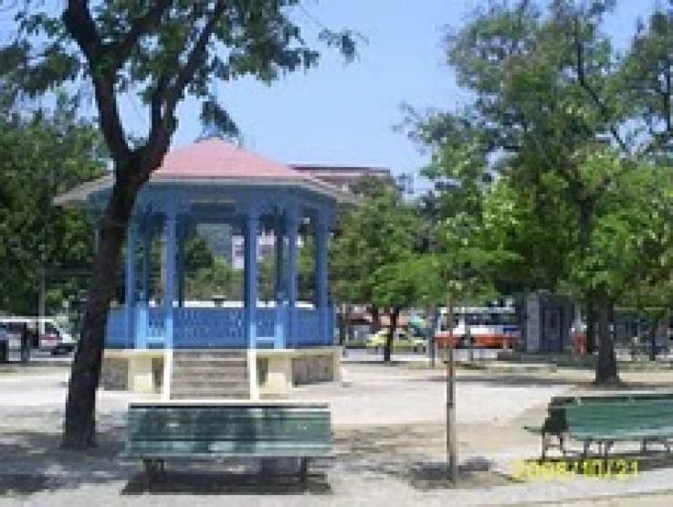 an empty blue and white park with trees