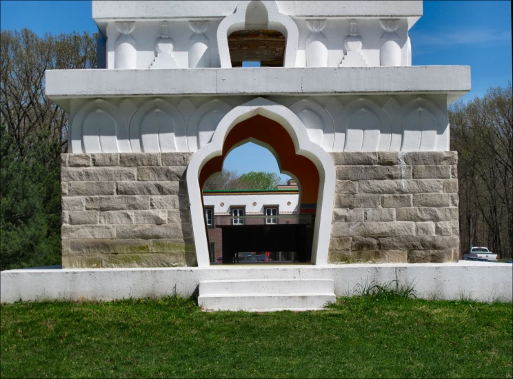 a very tall white monument with an open window