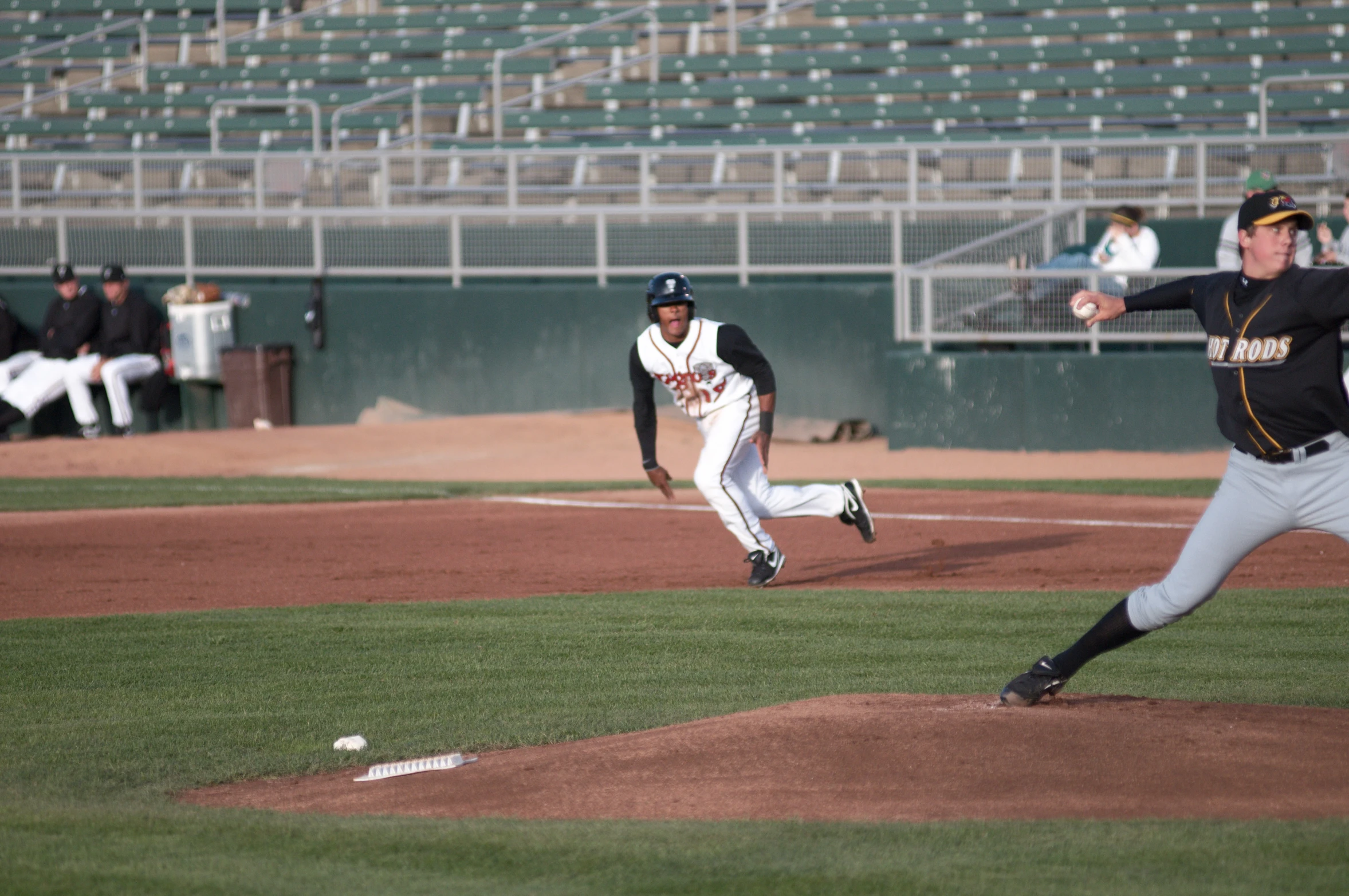 two men playing baseball on a baseball field