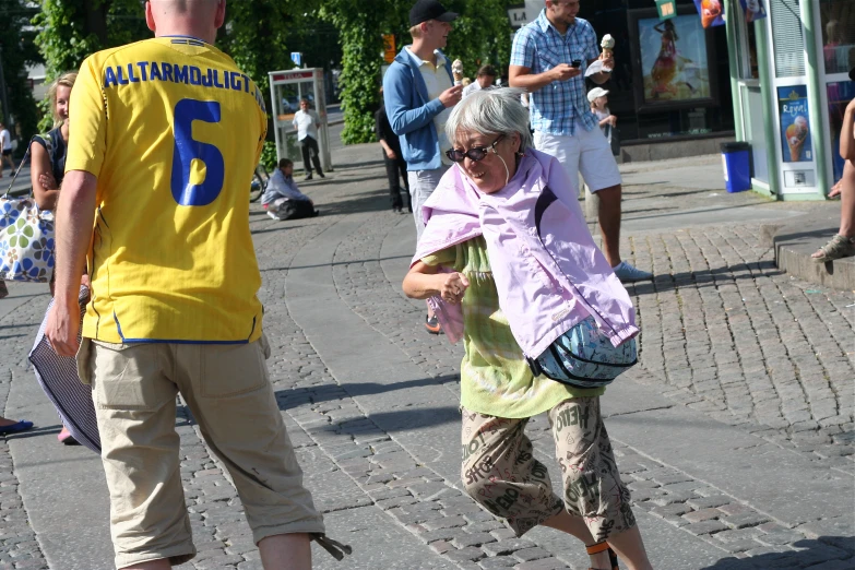 a woman with glasses is in the middle of a street