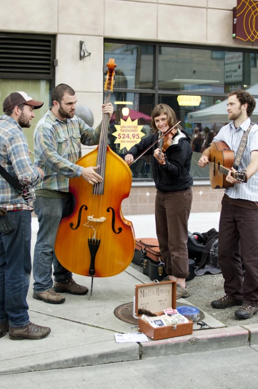 a group of people standing next to each other playing musical instruments