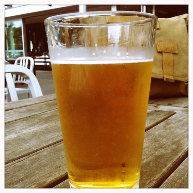 beer in a glass is sitting on a table