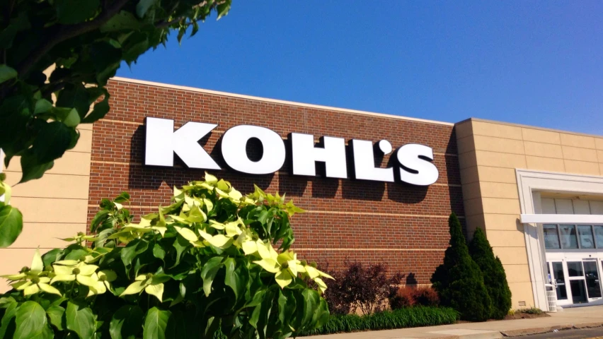 the front of kohl's grocery store with trees and shrubs around it