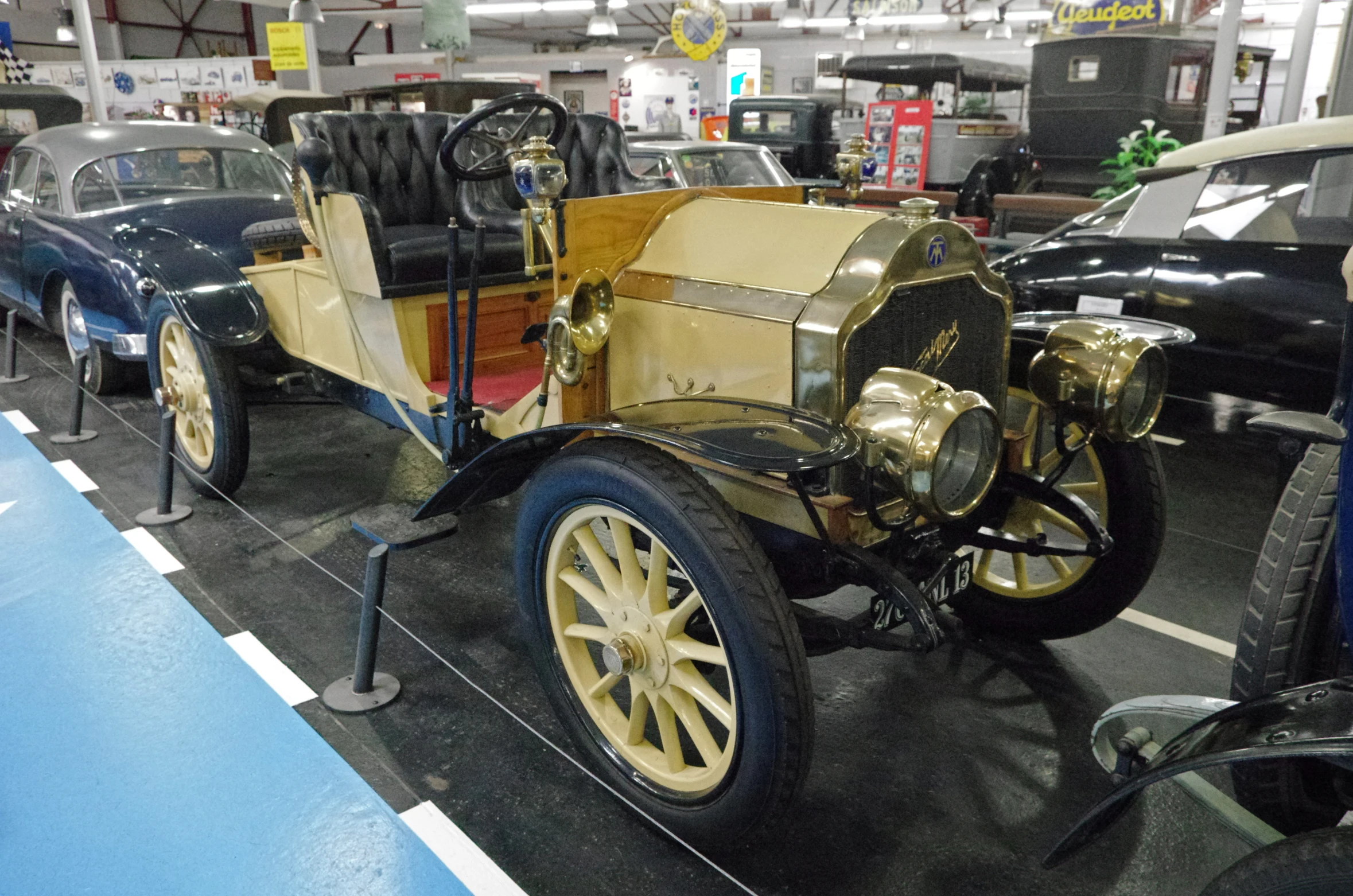 a row of cars that are on display in a museum