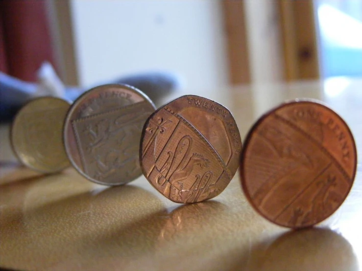 three coins lying next to each other on the table