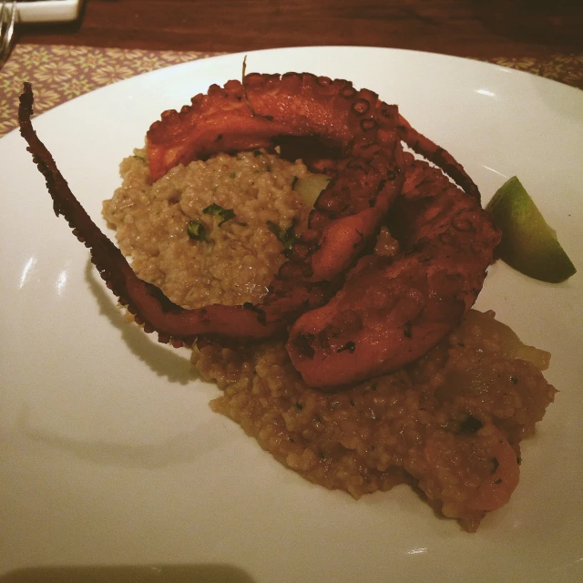 food is laid out on a white plate on the table