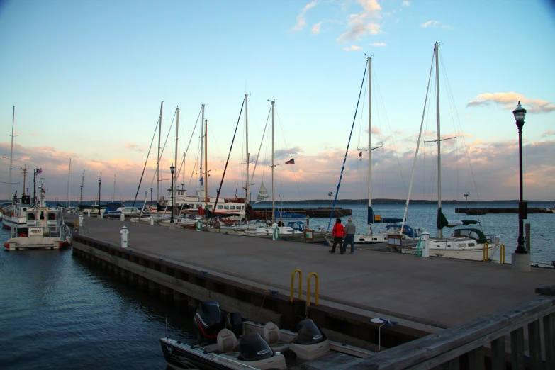 a group of sail boats parked at a dock