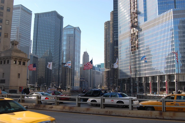 taxi cabs are driving down a busy city street