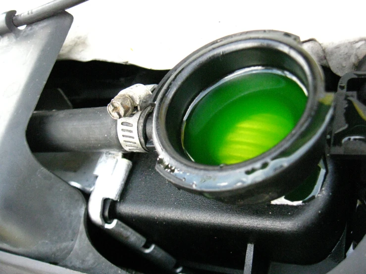 the fuel cap is glowing green in the vehicle's engine