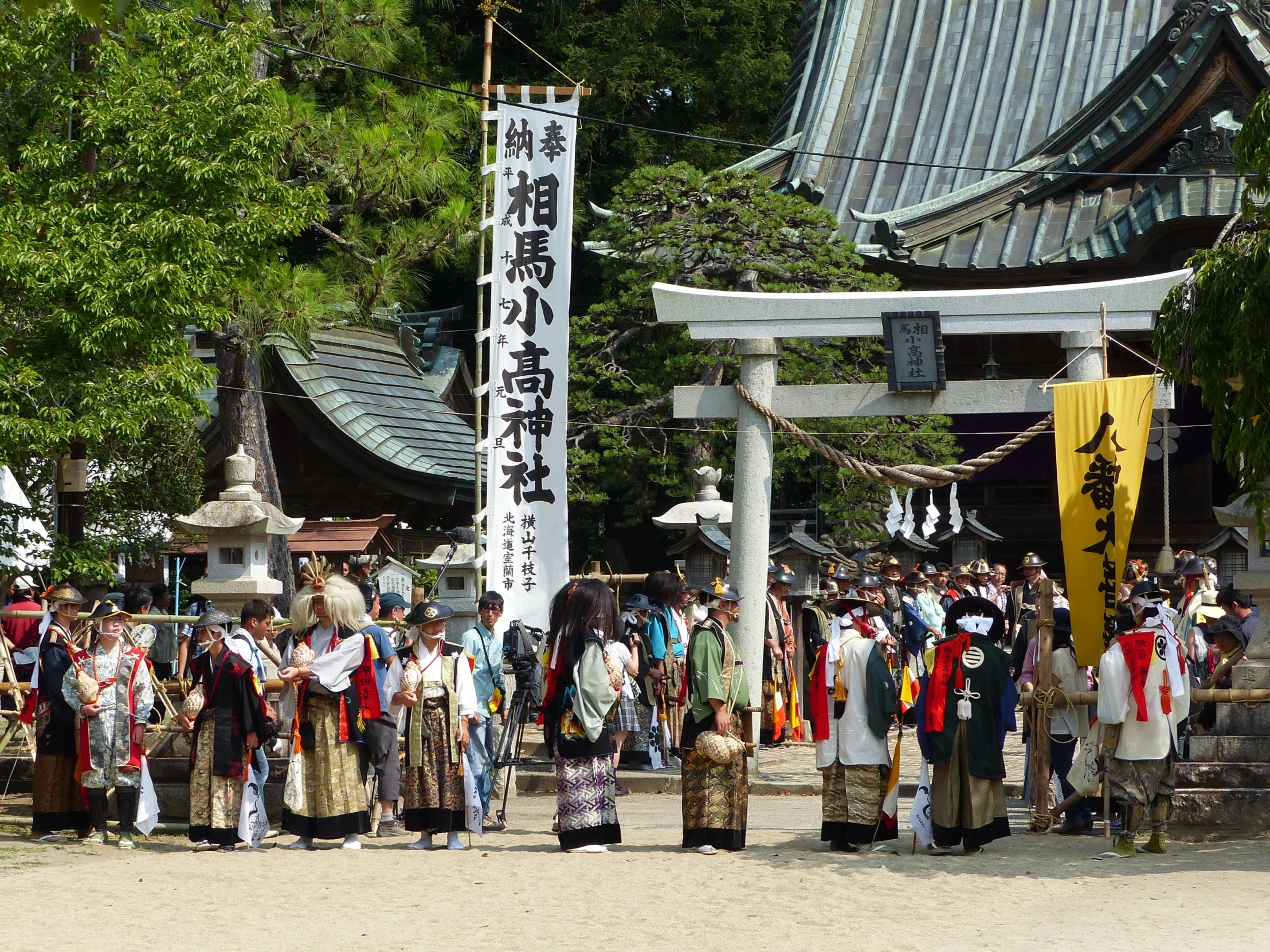 a large crowd of people gathered under the sign