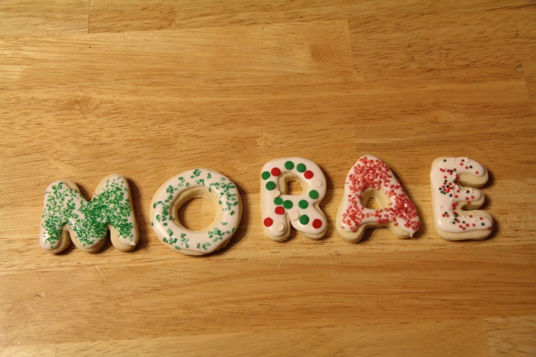 a number of decorated letter cookies sit in the shape of the word moscala