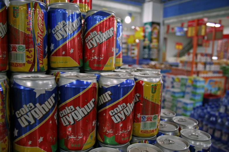 cans of mountain dew are lined up in an aisle