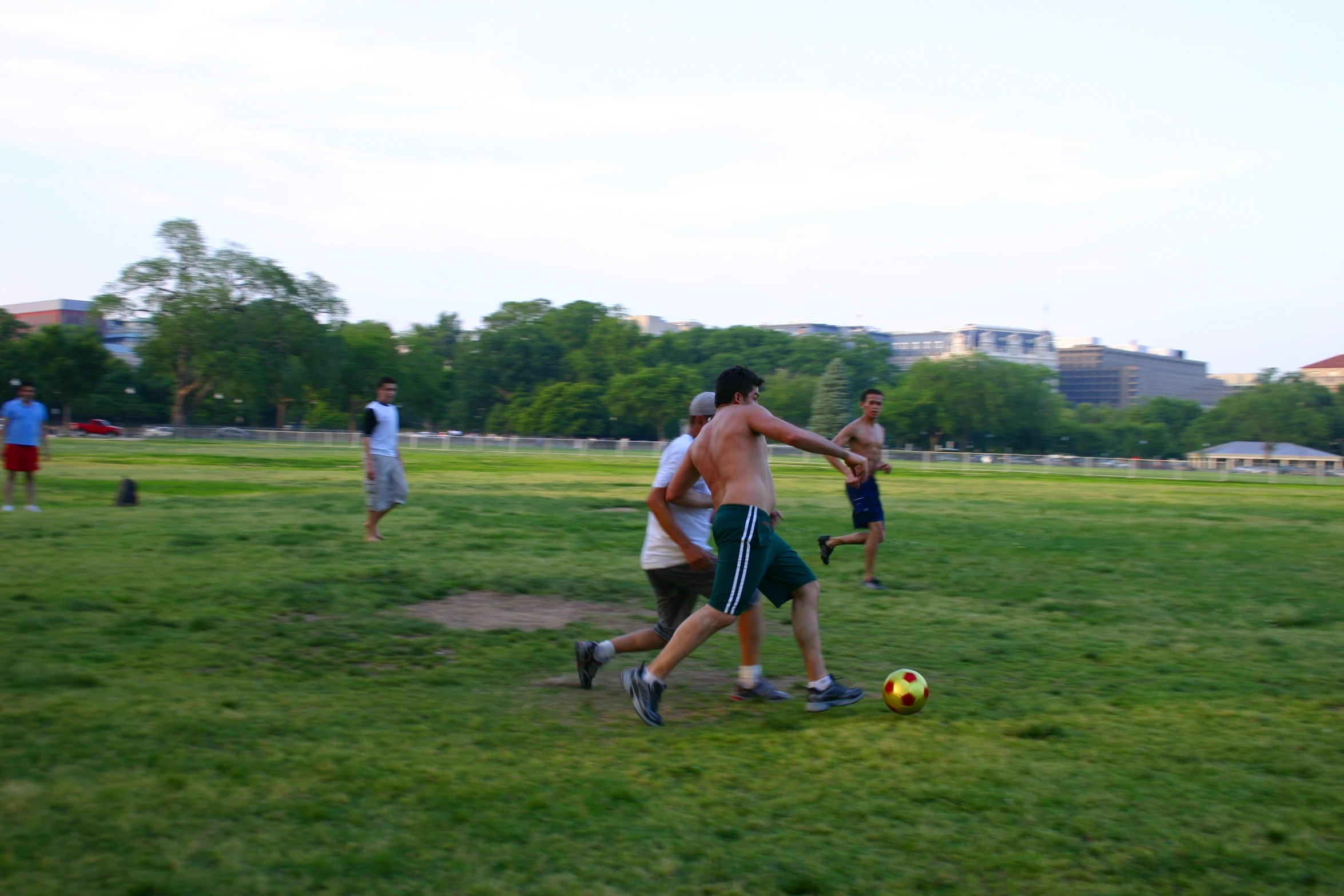 a group of young people playing soccer on a field