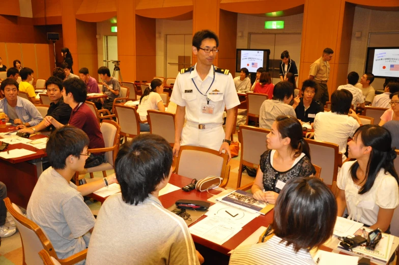 a group of people that are sitting at tables