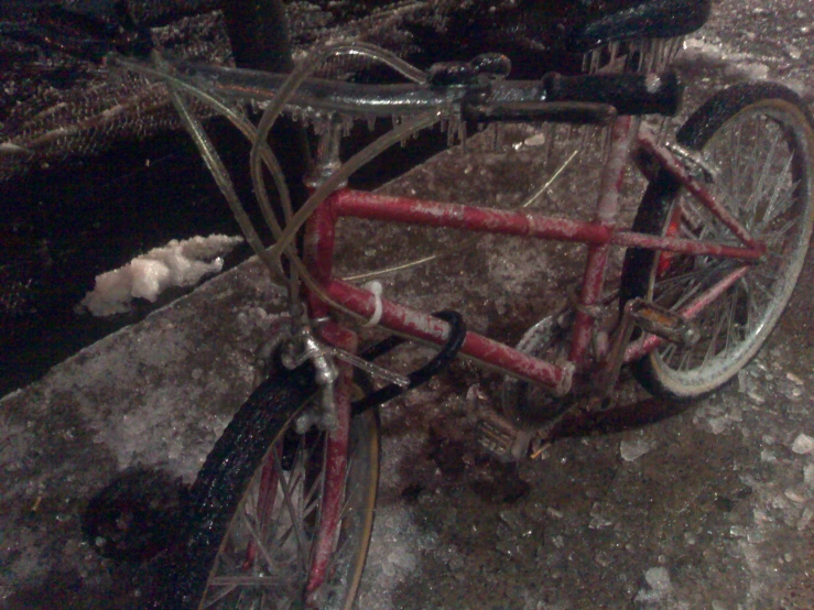 a close - up of a bicycle parked near some ice