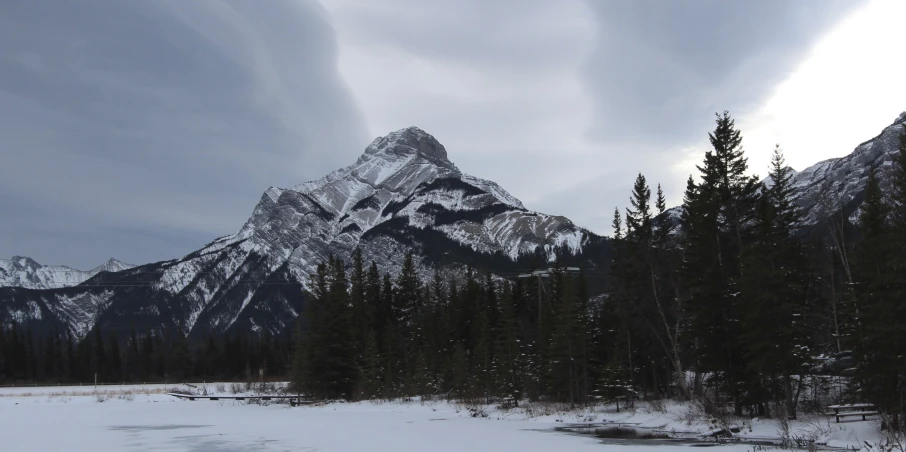 a large snow covered mountain on a gloomy day