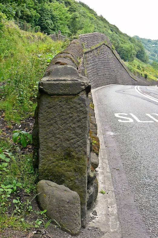 a concrete structure on the side of a road