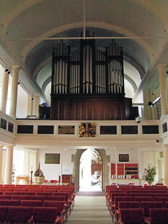 this is an image of inside a church with a pipe organ