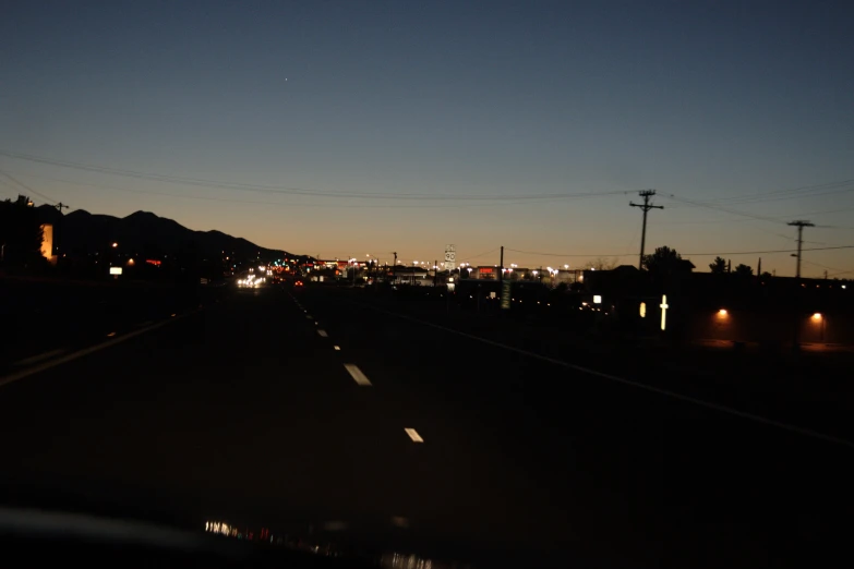 a night scene with a mountain in the background