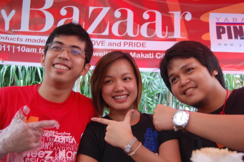 a man and two women posing for a picture together