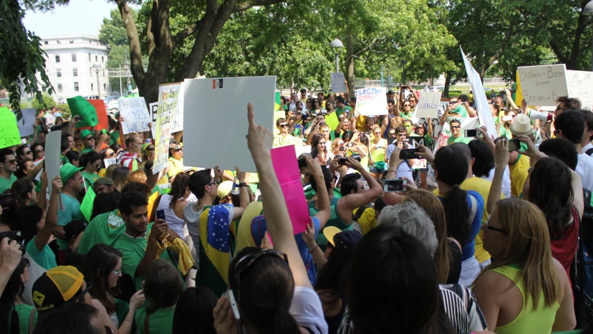 a bunch of people holding up signs in a group