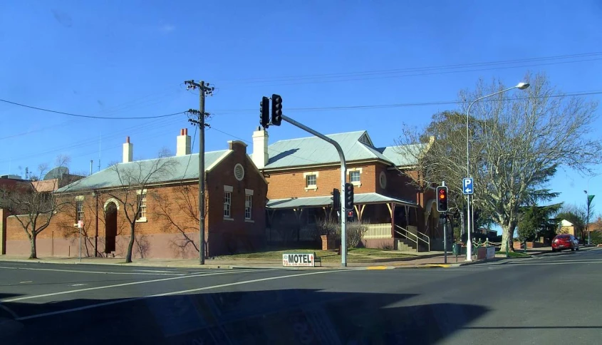 a red brick building near a stoplight