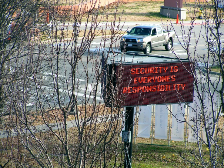 an electronic parking sign reading security is everywhere