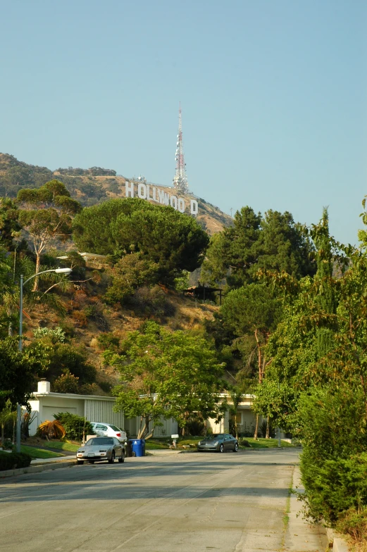 a picture of a town on a hill with trees