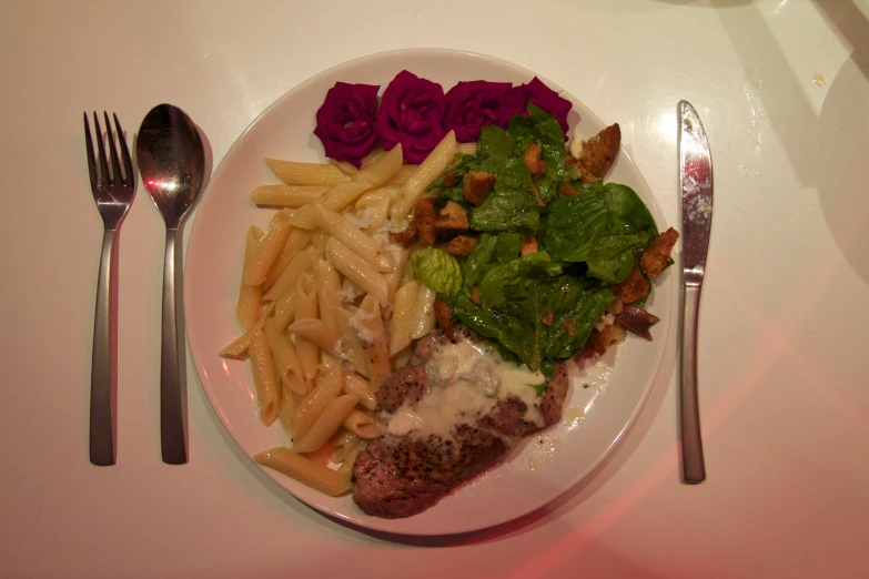 a plate topped with french fries, chicken and other toppings