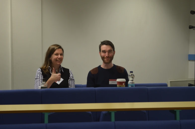 the couple is at a meeting room, talking about their business