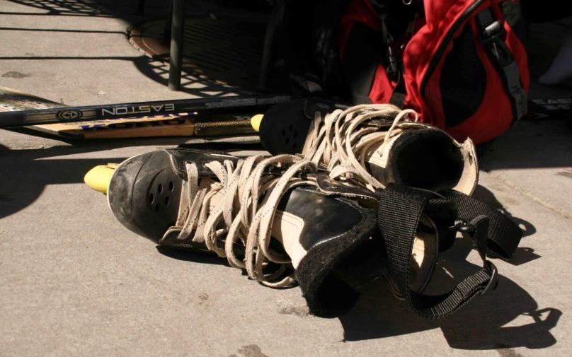 an image of a pair of hockey boots that has fallen down