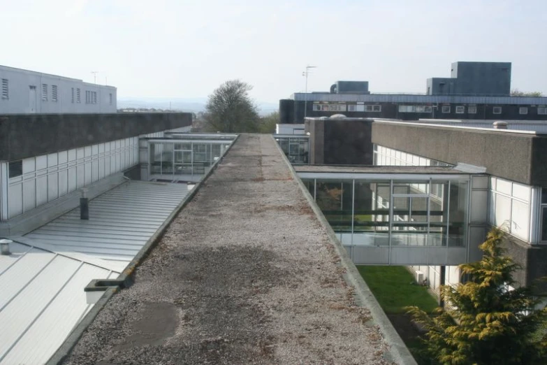 a roof with glass walls on a city skyline