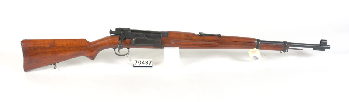 a wooden rifle mounted on the wall