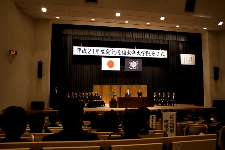 auditorium with podium and two men on the podiums