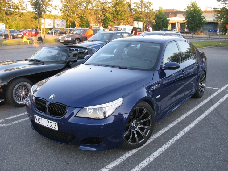 a car parked next to another car in a parking lot