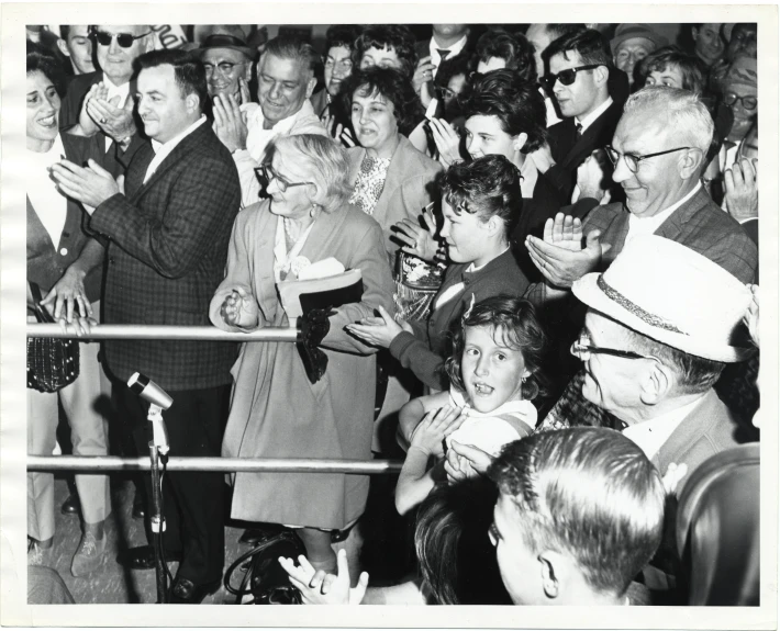 a group of people that are standing in a crowd